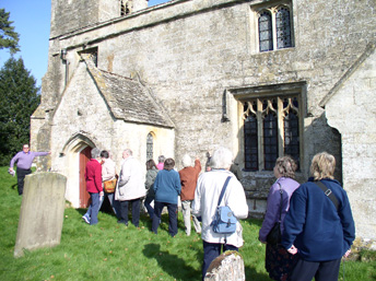 Members of the group on one of the April 2009 tours examining mysterious exterior markings at a church in the Cotswolds.